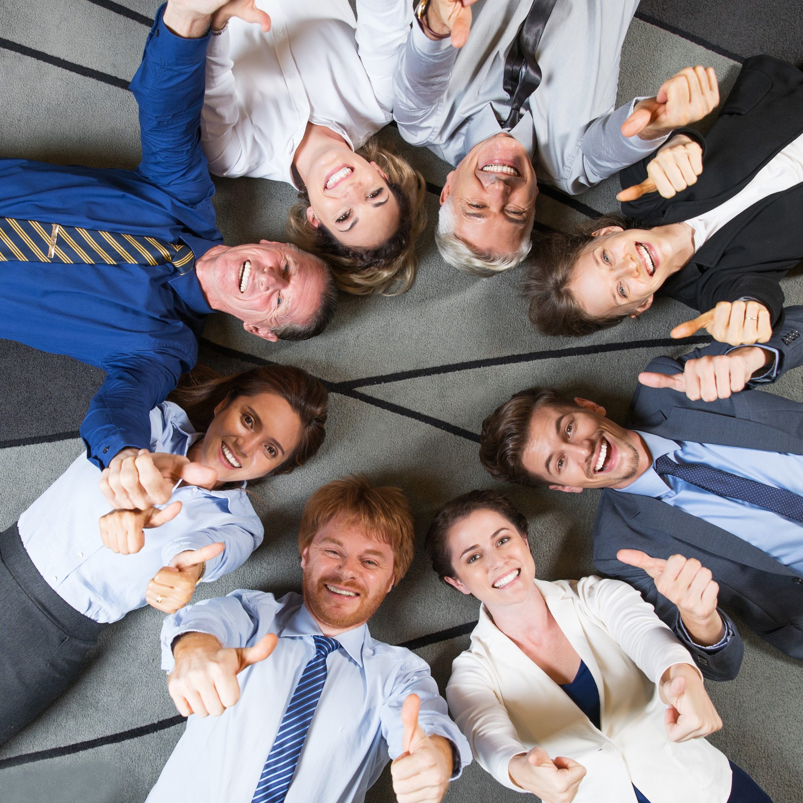 Cheerful Successful Business Team with Thumbs Up
